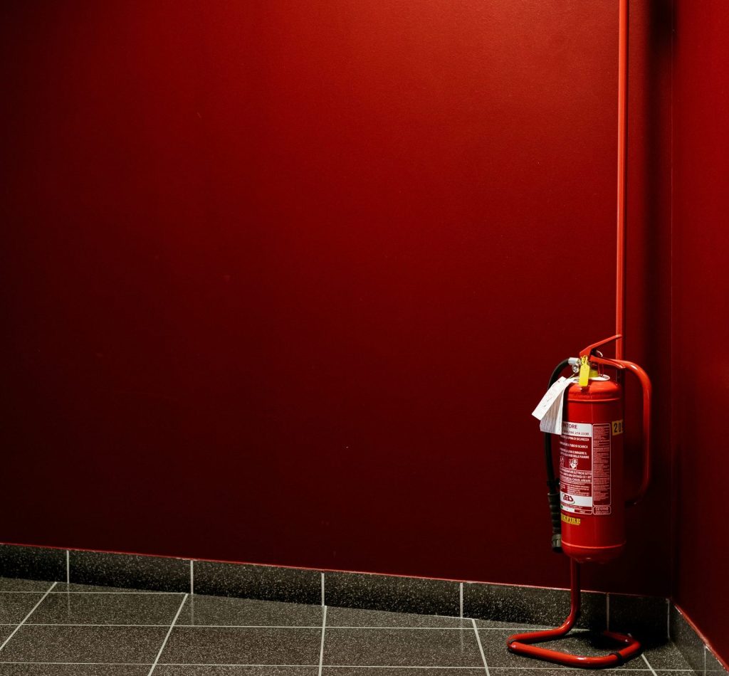 red fire extinguisher on corner